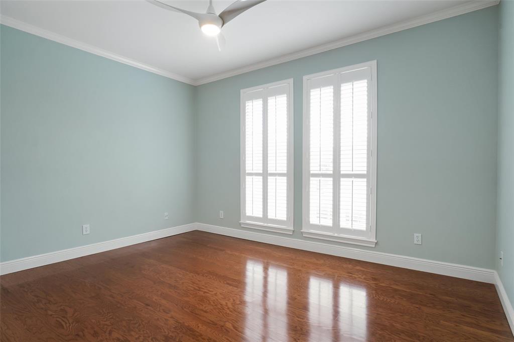 1229 Wooded Trail Hurst, TX 76053 - Photo 22 of 28 2nd bedroom with ensuite featuring ornamental molding, dark wood finished floors, and ceiling fan
