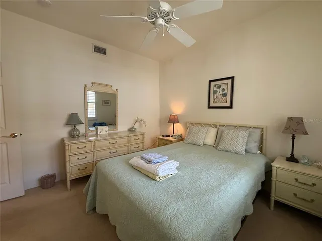 a bed room with a bed and a chandelier