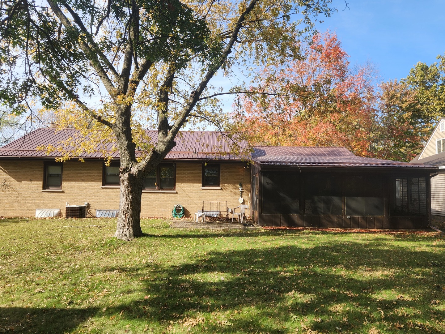 45 Locust Street Prophetstown, IL 61277 - Photo 13 of 14 a front view of house with yard space and tree