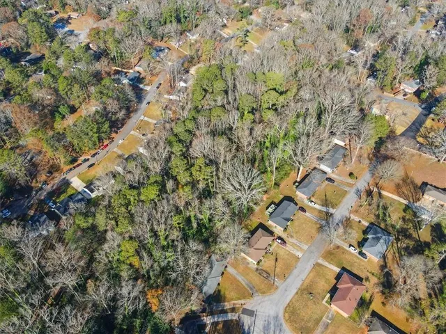 a view of outdoor space with lots of bushes