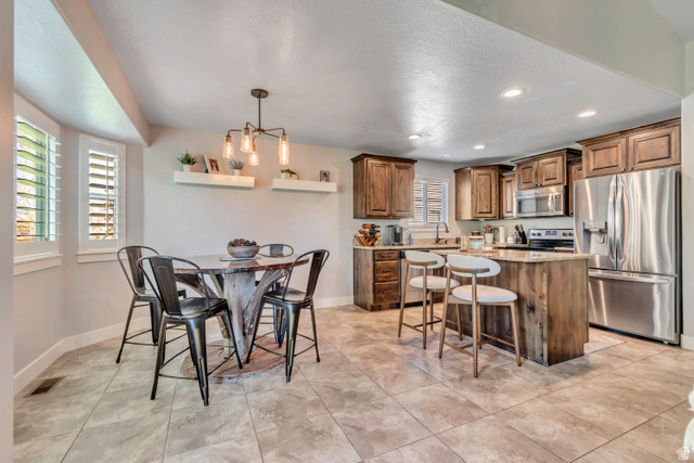 1071 Jamie-Matt Circle Layton, UT 84041 - Photo 16 of 28 Dining space with recessed lighting and light tile patterned flooring
