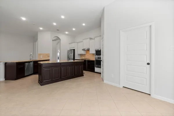 a view of kitchen and kitchen with furniture