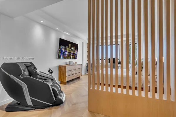 a bed room with a bed and a television