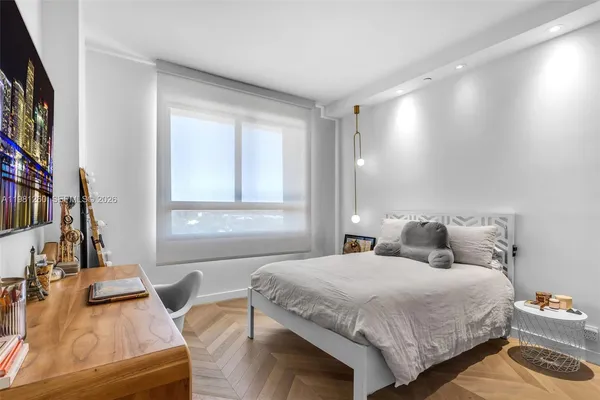 a bedroom with furniture and a gym equipment