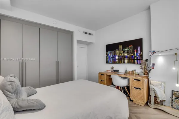 a bedroom with furniture and a bed