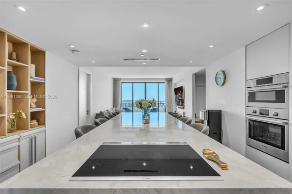 a view of kitchen with stainless steel appliances granite countertop sink stove and cabinets