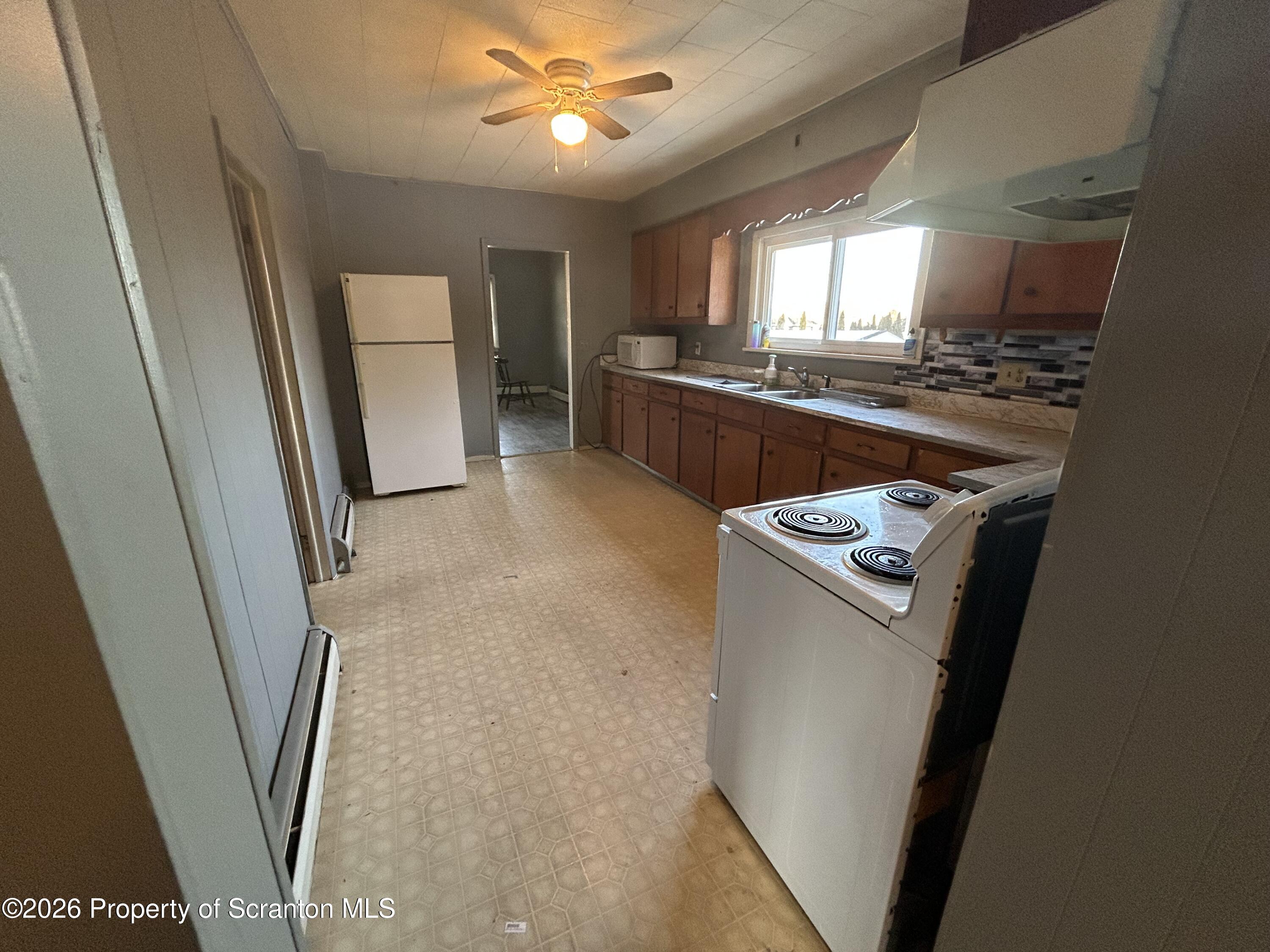 1849 Clearview Street Scranton, PA 18508 - Photo 3 of 6 a kitchen with a refrigerator a sink and dishwasher
