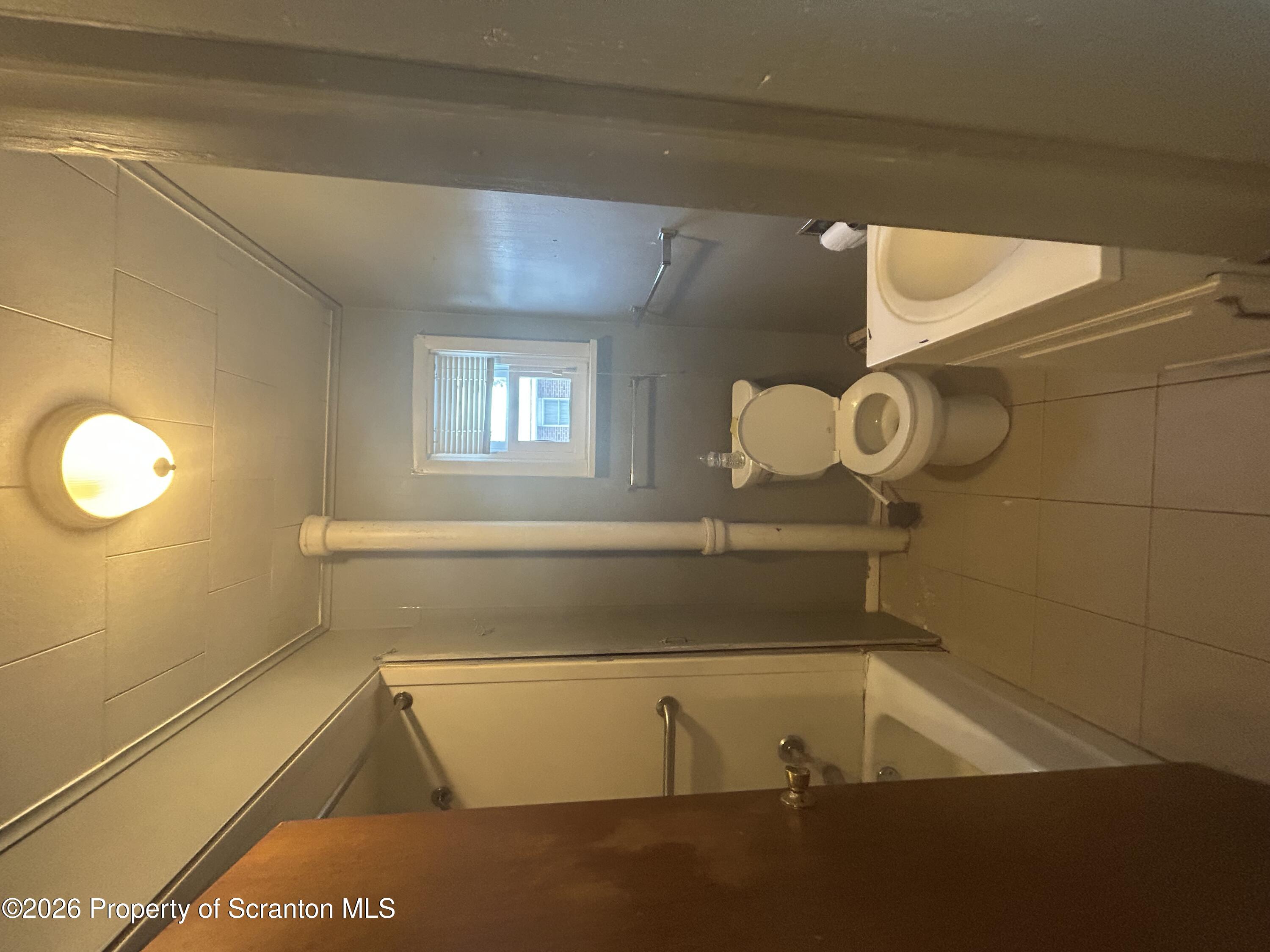 1849 Clearview Street Scranton, PA 18508 - Photo 4 of 6 a bathroom with a sink and a mirror