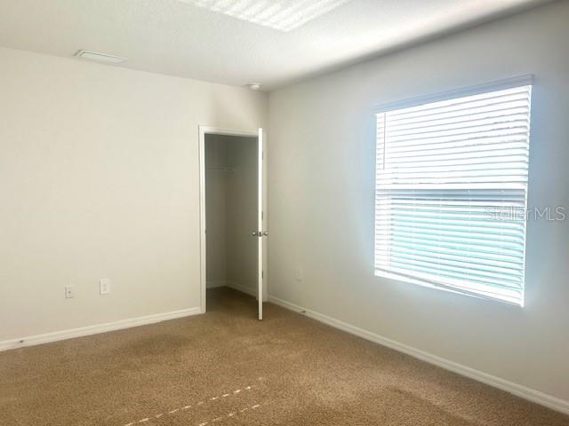 8640 Milestone Drive Sarasota, FL 34238 - Photo 12 of 18 an empty room with a window
