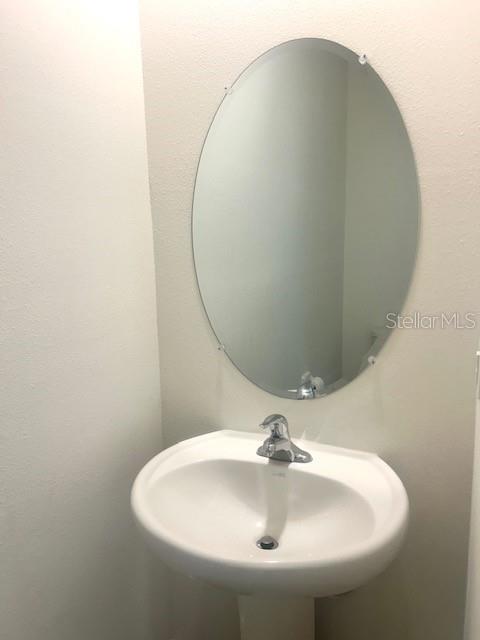 8640 Milestone Drive Sarasota, FL 34238 - Photo 3 of 18 a close up of a sink and a mirror