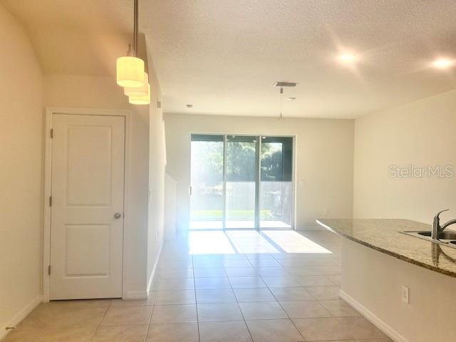 8640 Milestone Drive Sarasota, FL 34238 - Photo 4 of 18 a view of an empty room with a window