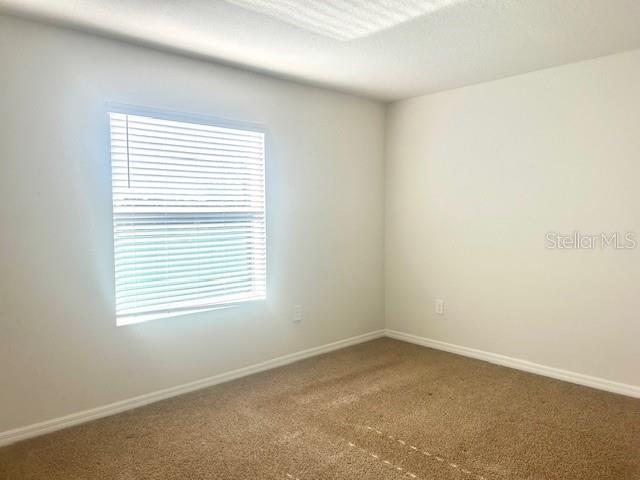 8640 Milestone Drive Sarasota, FL 34238 - Photo 9 of 18 an empty room with a window