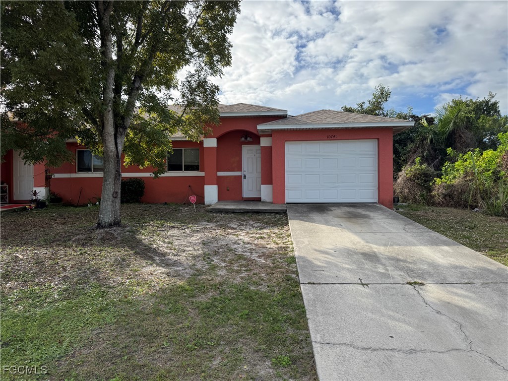 10743 Robinson Street Fort Myers, FL 33908 - Photo 10 of 11 a front view of a house with a yard