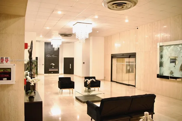 a view of a house with a yard and potted plants