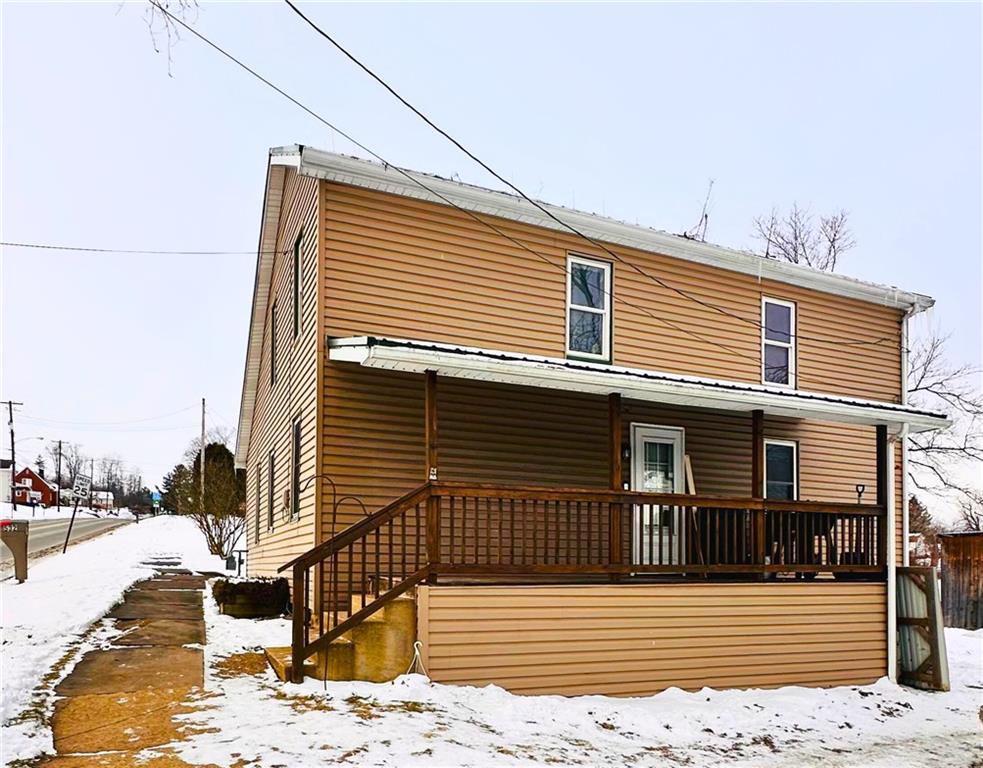 a front view of a house with wooden fence