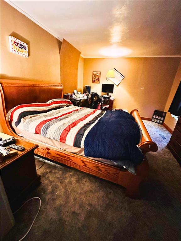 532 Washington Street Parker, PA 16049 - Photo 11 of 19 a bed sitting in a bedroom next to a larger window