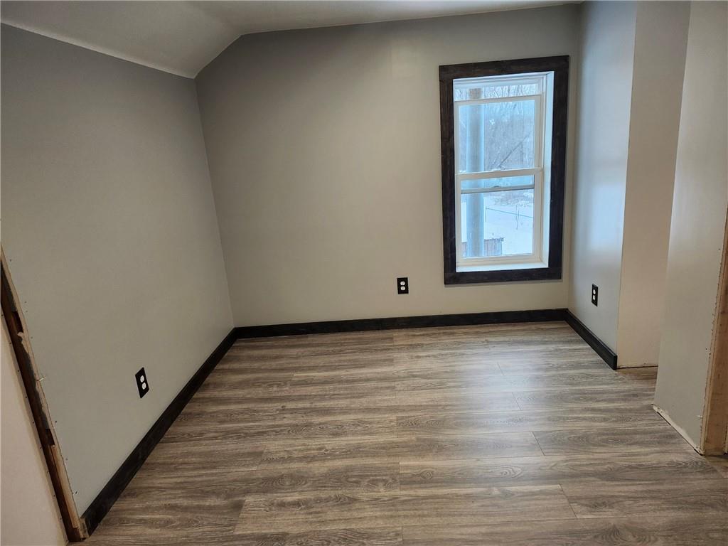 532 Washington Street Parker, PA 16049 - Photo 12 of 19 an empty room with wooden floor and windows