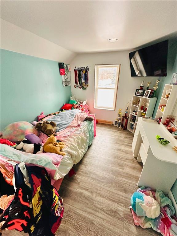 532 Washington Street Parker, PA 16049 - Photo 15 of 19 a bedroom with a bed and flat screen tv