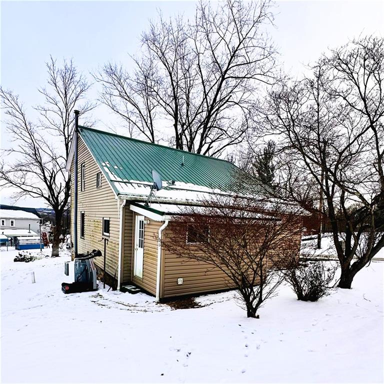 532 Washington Street Parker, PA 16049 - Photo 2 of 19 a view of a house with snow in the snow