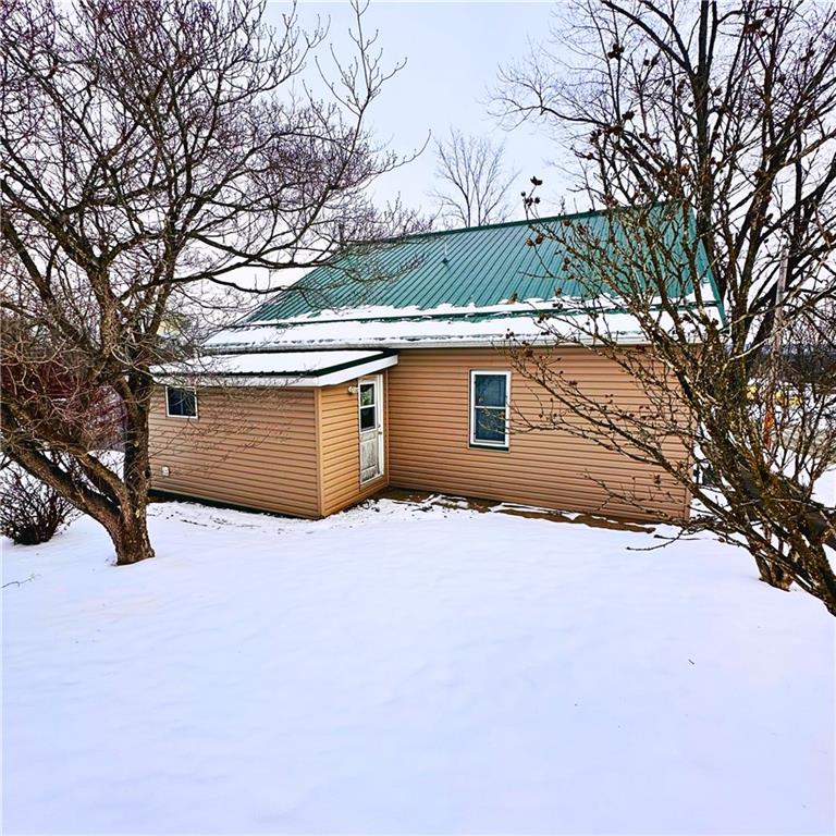 532 Washington Street Parker, PA 16049 - Photo 3 of 19 a view of a house with a yard covered in snow