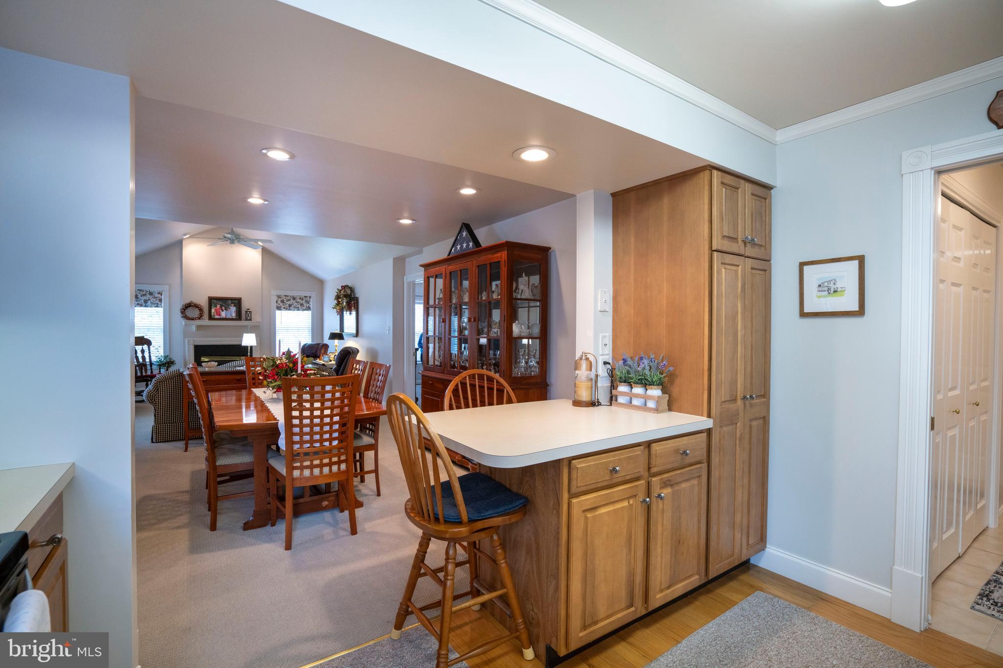 3291 Shellers Bend, Unit 715 State College, PA 16801 - Photo 14 of 45 a room with a table chairs and a refrigerator
