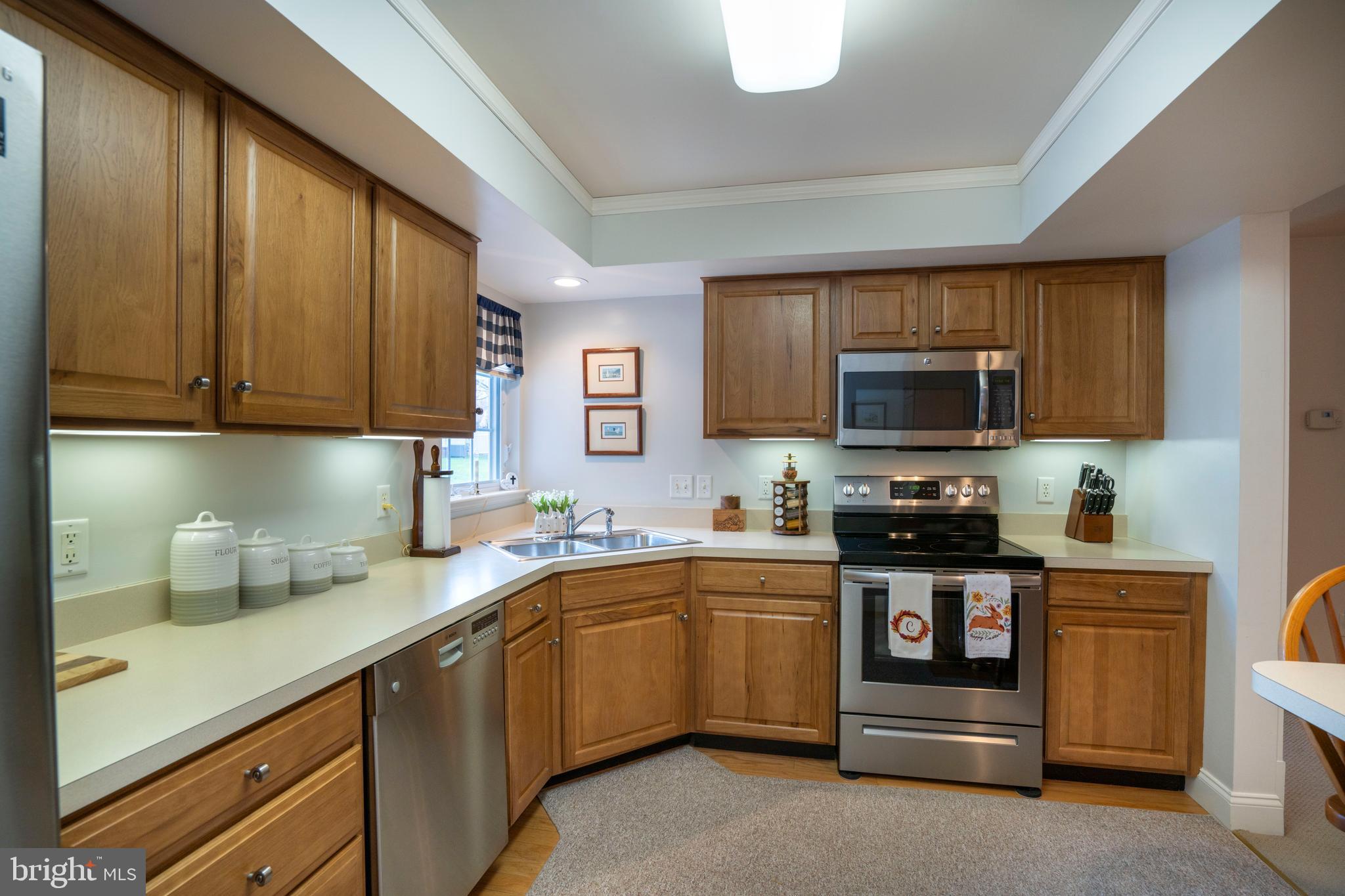 3291 Shellers Bend, Unit 715 State College, PA 16801 - Photo 15 of 45 a kitchen with a sink a stove and cabinets