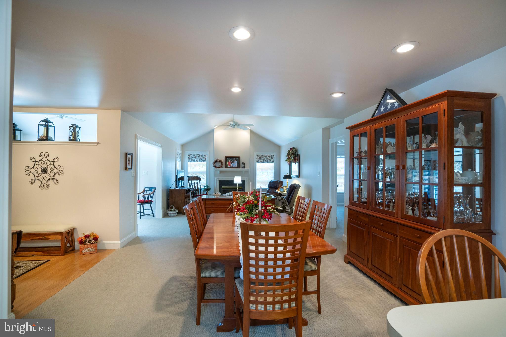 3291 Shellers Bend, Unit 715 State College, PA 16801 - Photo 17 of 45 a dining room with furniture a rug and wooden floor