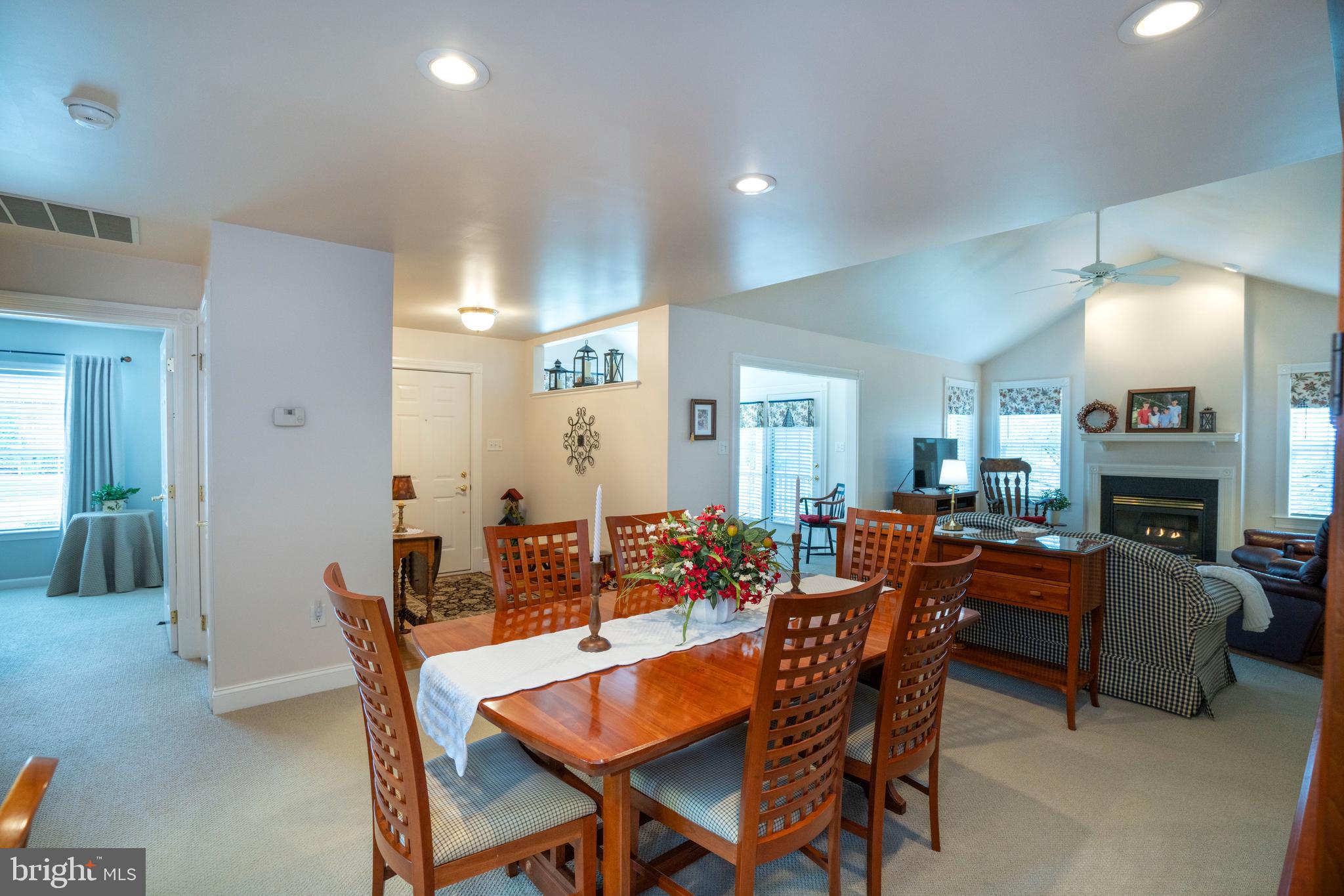 3291 Shellers Bend, Unit 715 State College, PA 16801 - Photo 18 of 45 a dining room with furniture and a fireplace