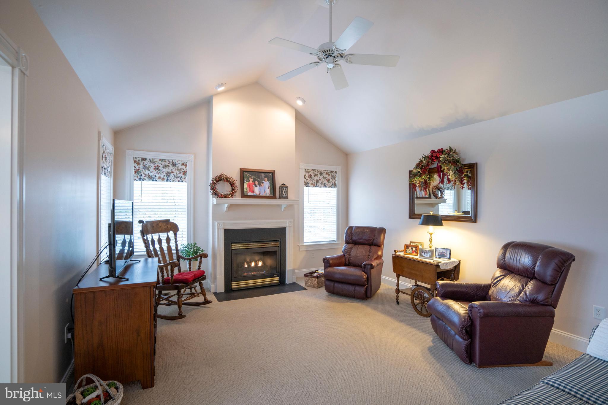3291 Shellers Bend, Unit 715 State College, PA 16801 - Photo 20 of 45 a living room with furniture and a fireplace