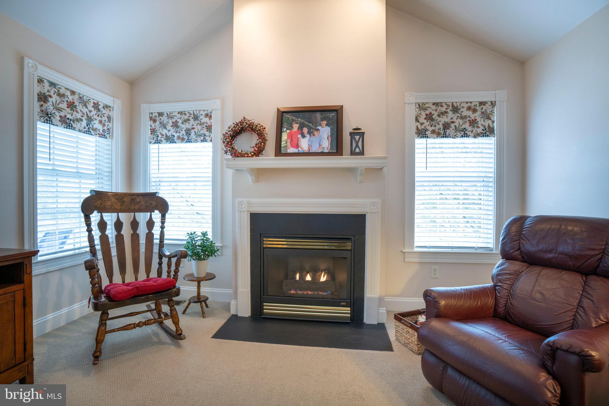 3291 Shellers Bend, Unit 715 State College, PA 16801 - Photo 21 of 45 a living room with furniture and a fireplace