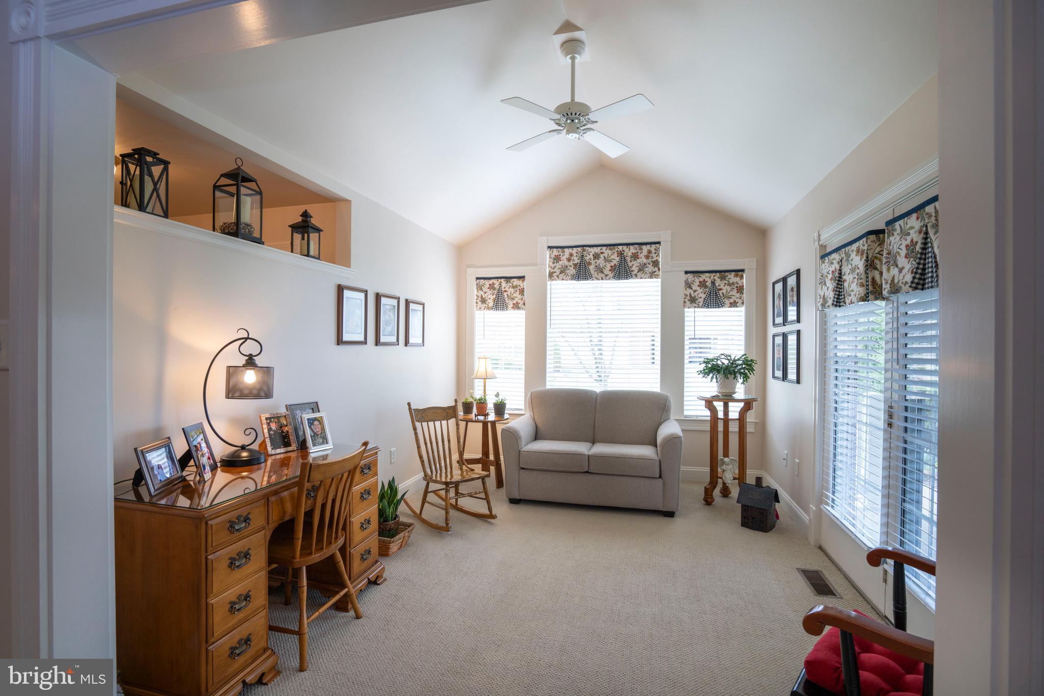 3291 Shellers Bend, Unit 715 State College, PA 16801 - Photo 23 of 45 a living room with furniture and a window