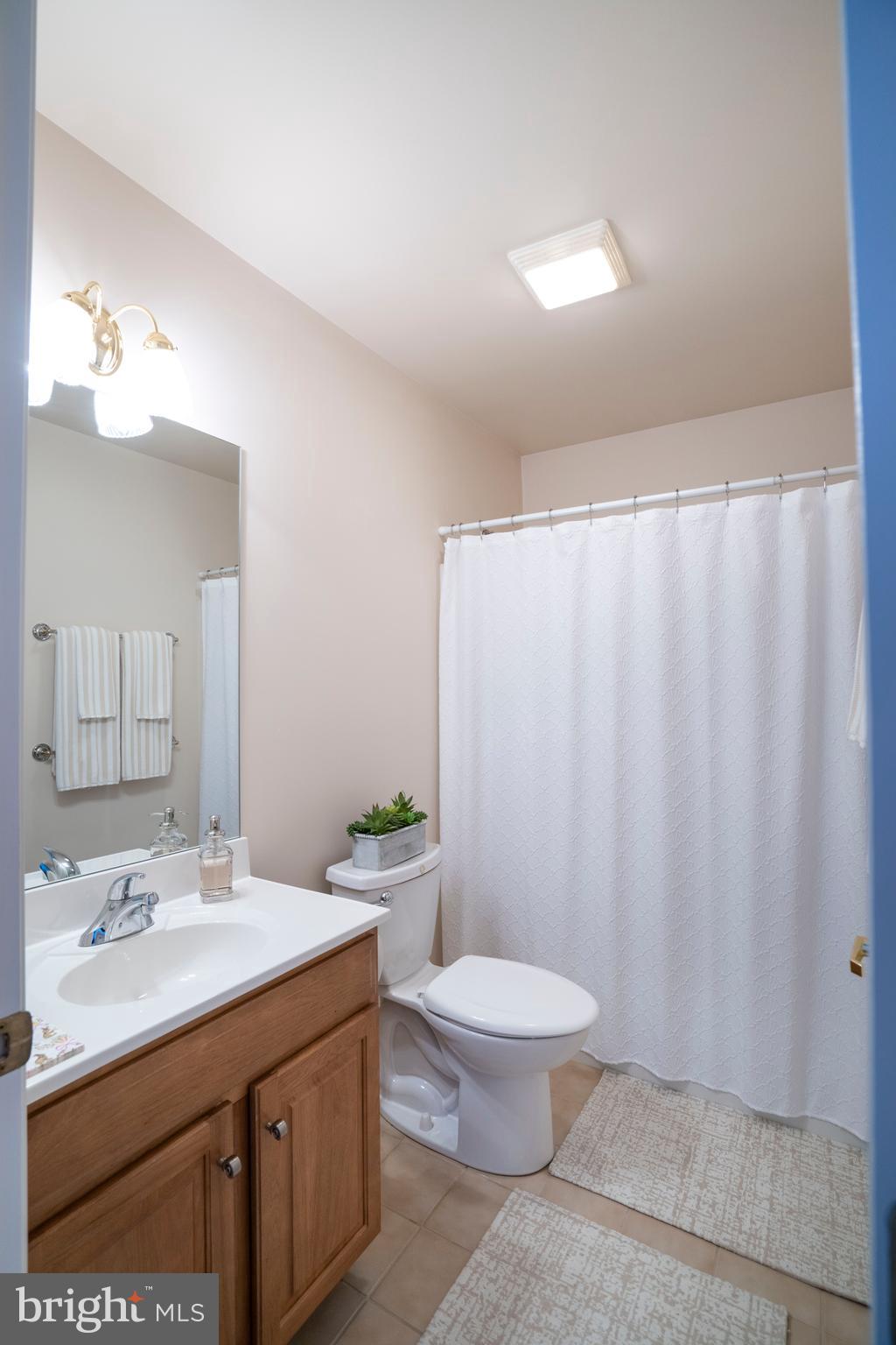 3291 Shellers Bend, Unit 715 State College, PA 16801 - Photo 26 of 45 a bathroom with a double vanity sink toilet and a mirror