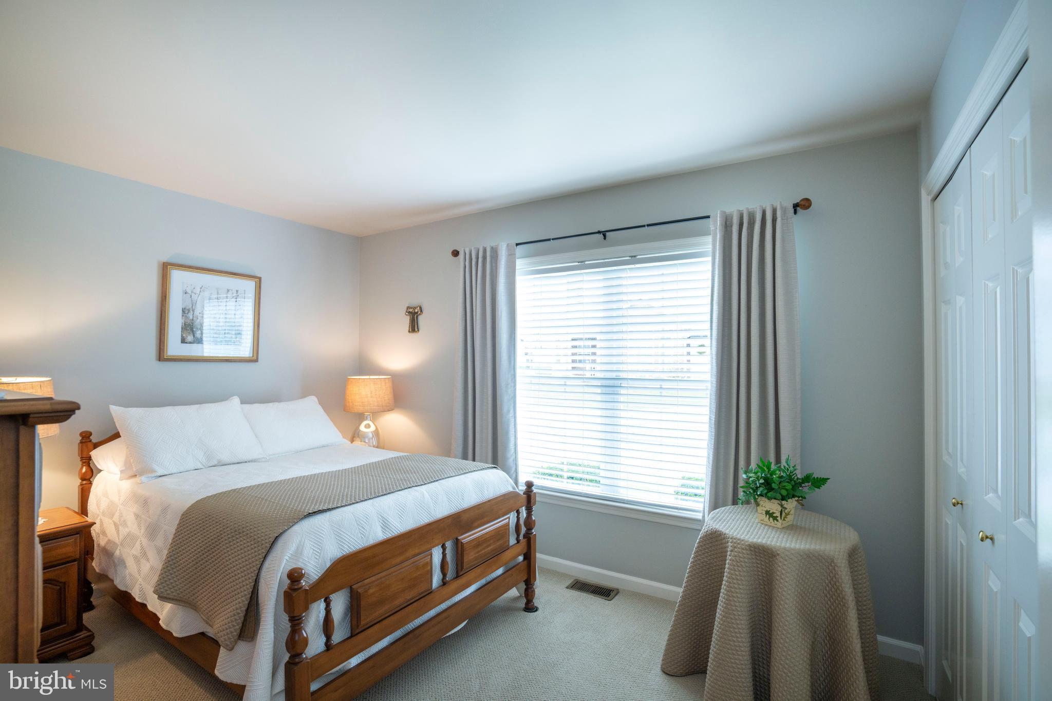 3291 Shellers Bend, Unit 715 State College, PA 16801 - Photo 27 of 45 a bedroom with a bed and a window