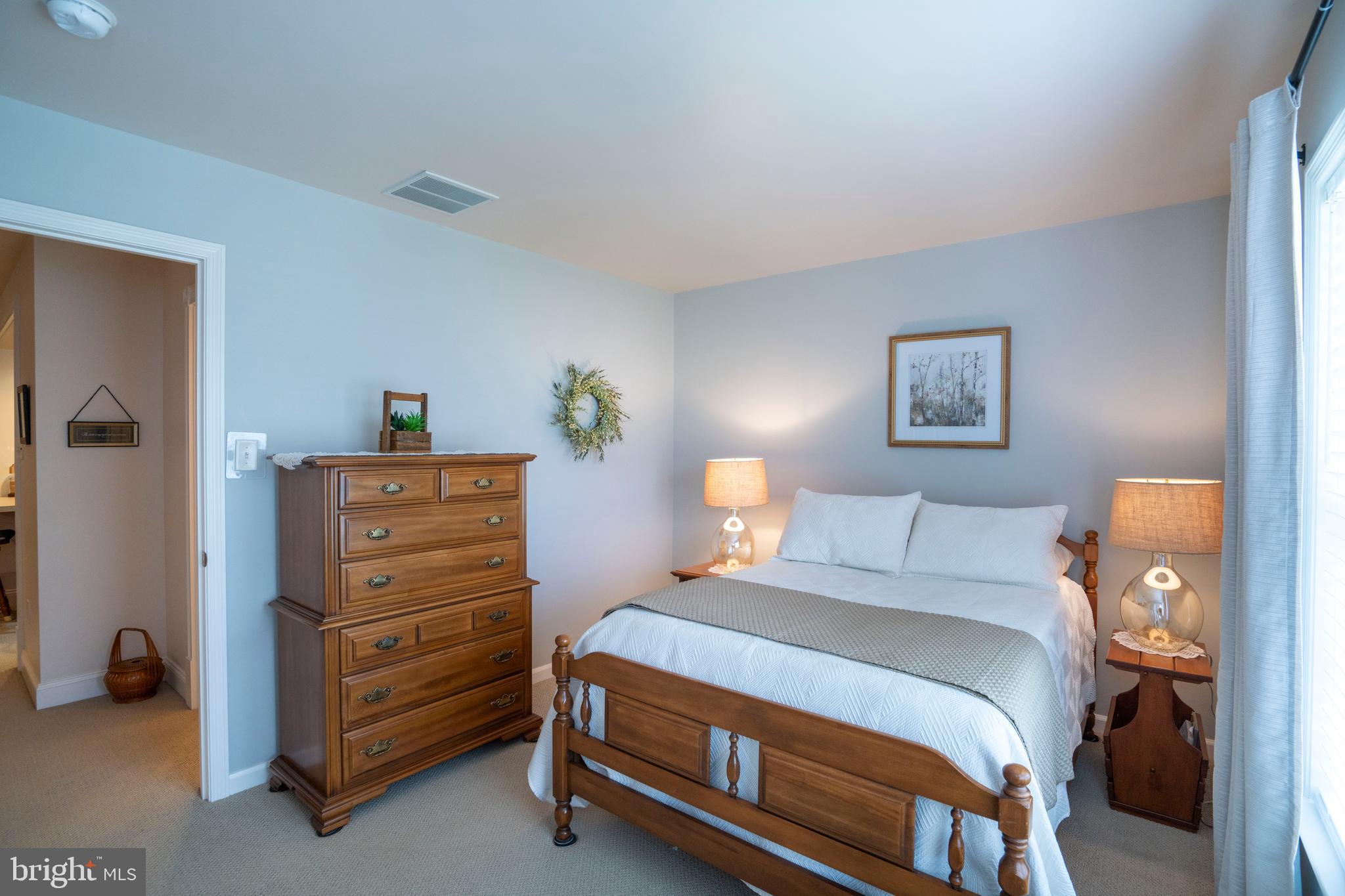 3291 Shellers Bend, Unit 715 State College, PA 16801 - Photo 28 of 45 a bedroom with a bed and a lamp