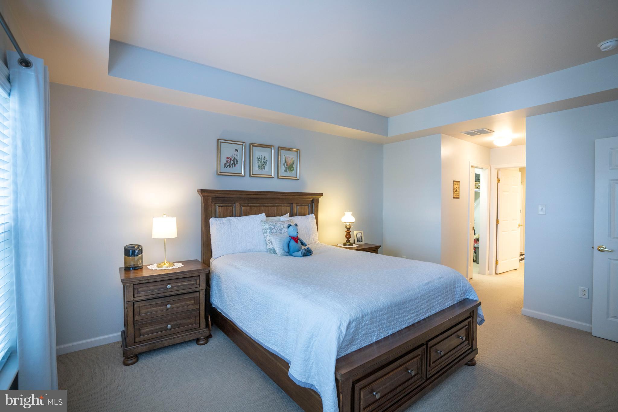 3291 Shellers Bend, Unit 715 State College, PA 16801 - Photo 31 of 45 a bedroom with a bed and a night stand