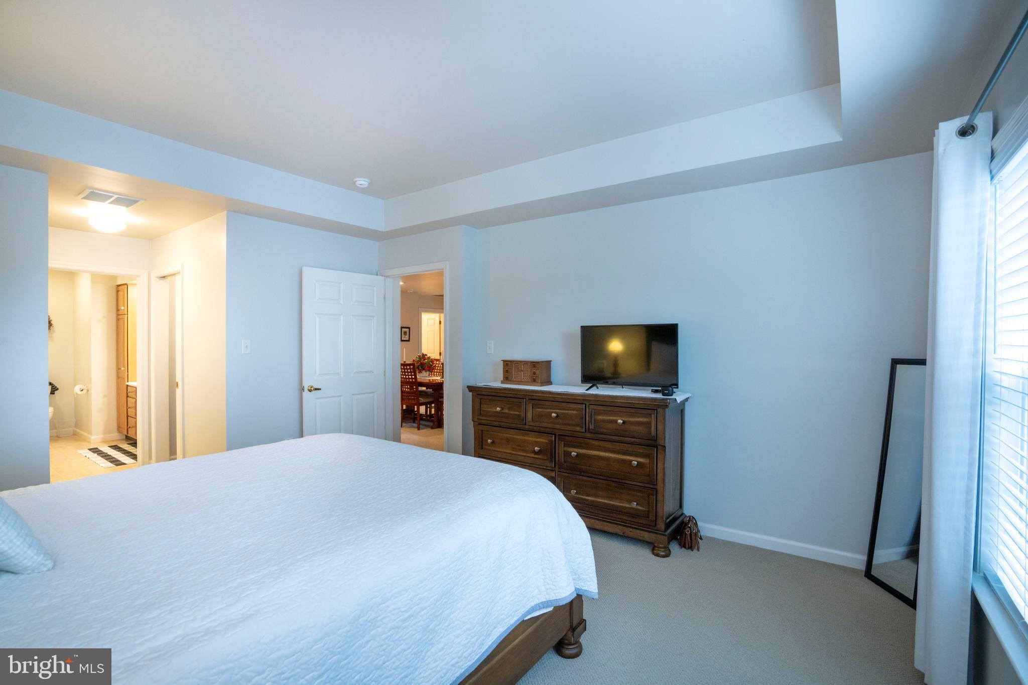 3291 Shellers Bend, Unit 715 State College, PA 16801 - Photo 32 of 45 a bedroom with a bed and flat screen tv