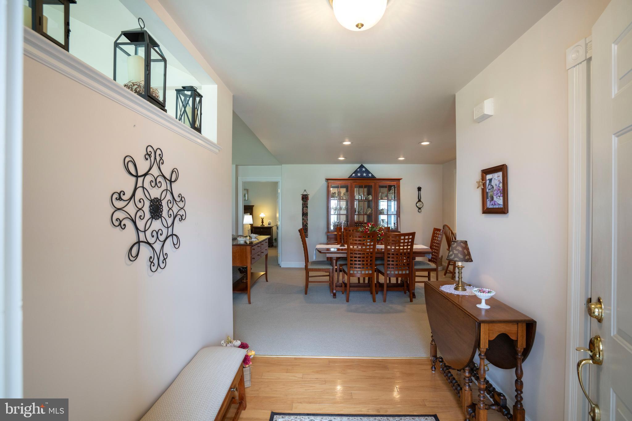 3291 Shellers Bend, Unit 715 State College, PA 16801 - Photo 8 of 45 a living room with furniture and a potted plant
