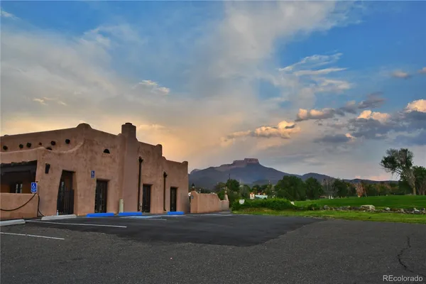a view of a building with a yard