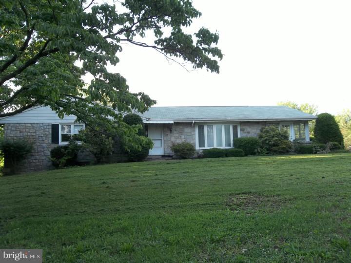 1019 Temple Road Pottstown, PA 19465 - Photo 1 of 13 a front view of a house with a yard