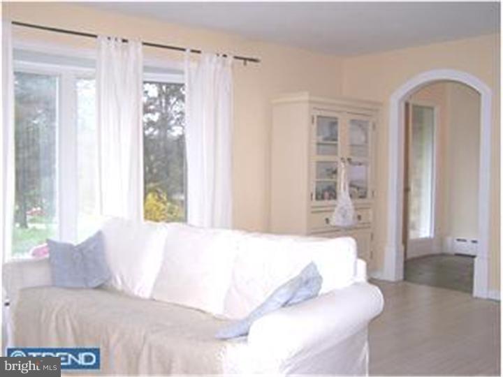 1019 Temple Road Pottstown, PA 19465 - Photo 3 of 13 a bedroom with a bed and a window