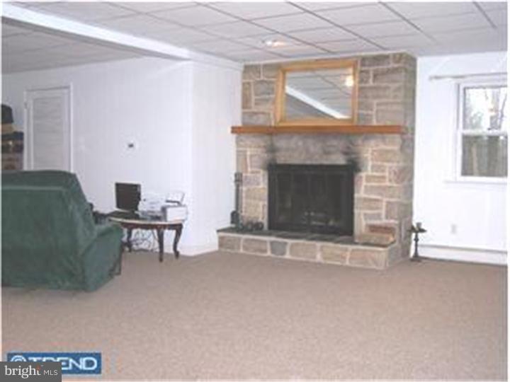 1019 Temple Road Pottstown, PA 19465 - Photo 8 of 13 a living room with furniture and a fireplace