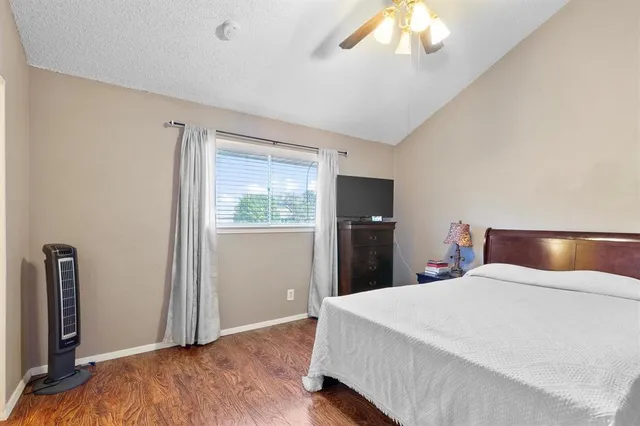 a bed room with a bed and a large mirror