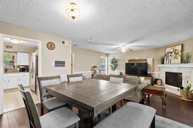 a view of kitchen dining table and chairs
