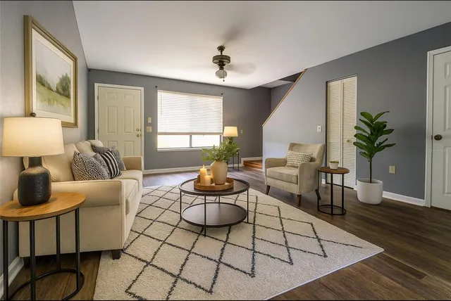 a living room with furniture and a table