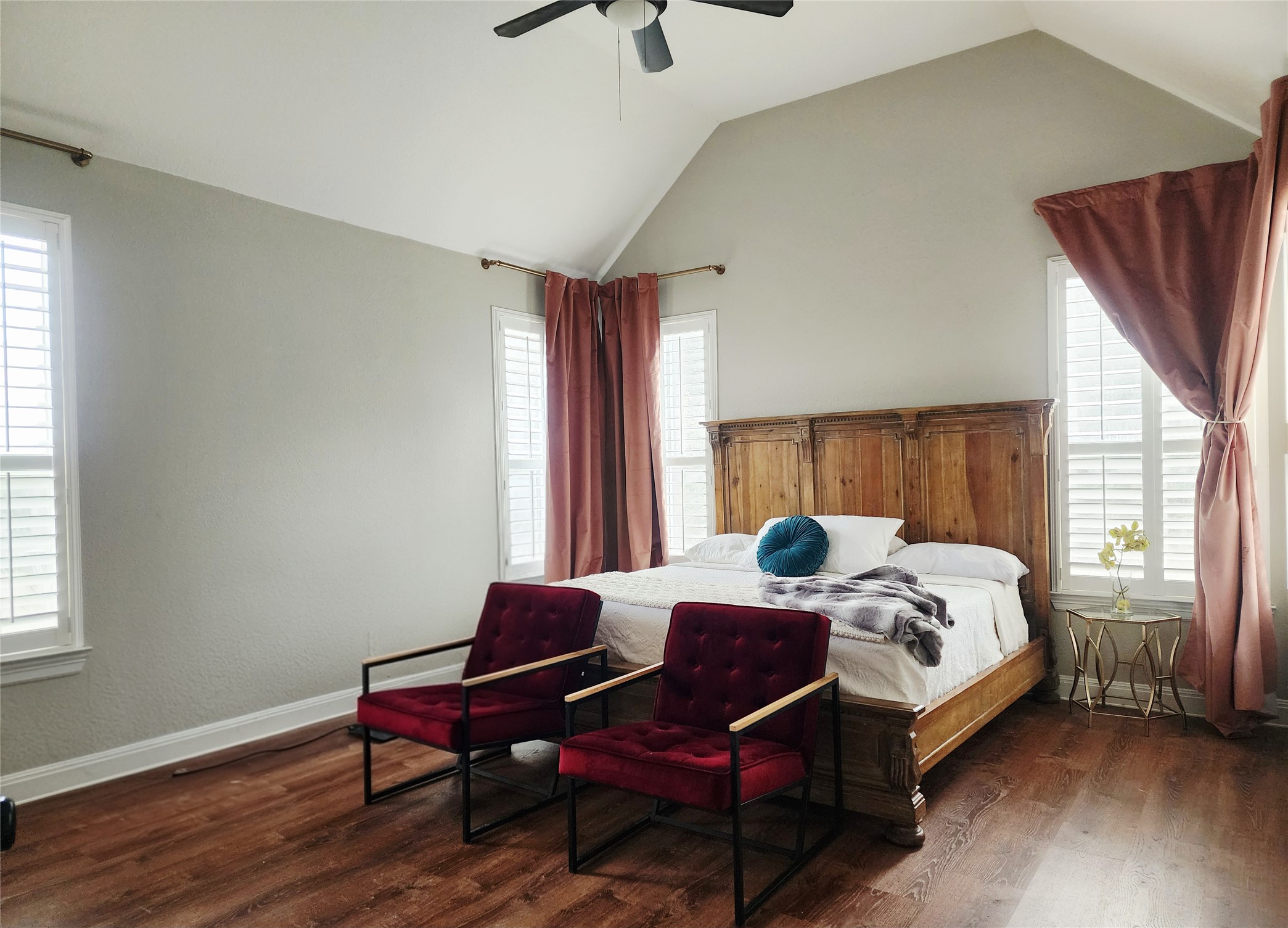 152 Silver Hawk Court Dripping Springs, TX 78620 - Photo 13 of 31 a bedroom with a bed and wooden floor
