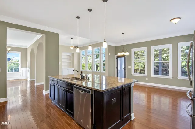a spacious bathroom with a double vanity sink and a large mirror