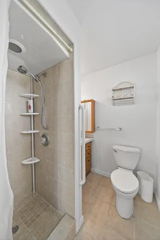 a view of an empty room and a potted plant