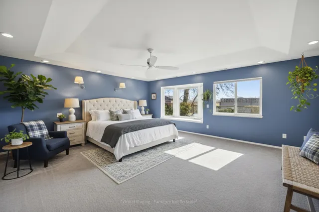 a bedroom with a bed potted plant with the window