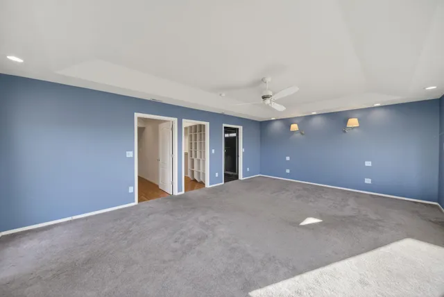 a view of an empty room with windows