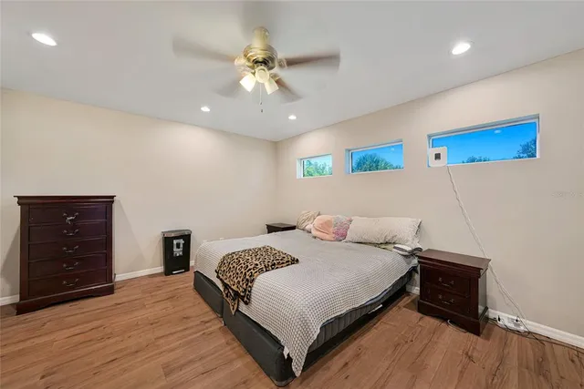 a bedroom with a bed and a dresser